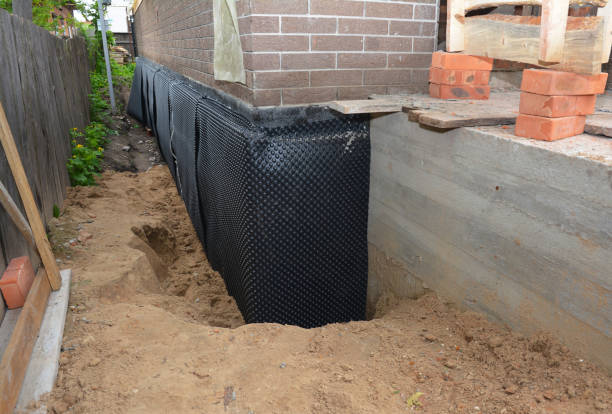 Happy homeowners after waterproofing job in Deepwater